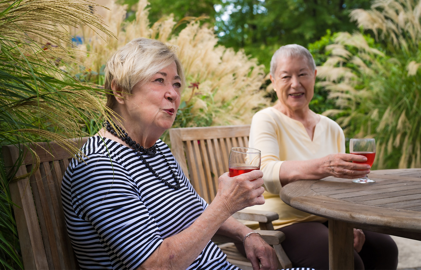 People having drinks in the garden.