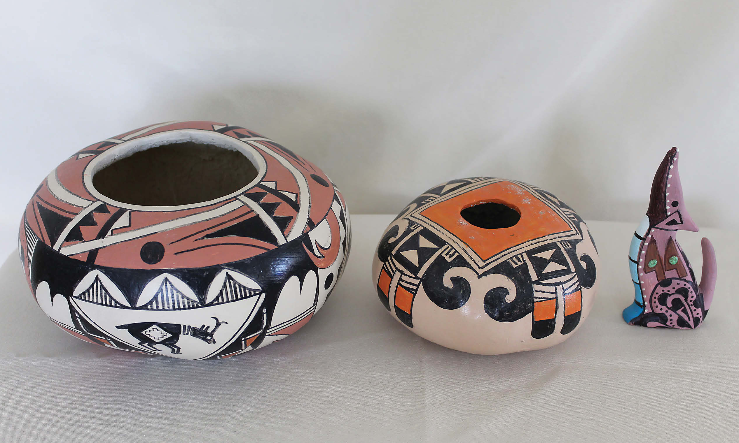 Two clay pots and sculpture