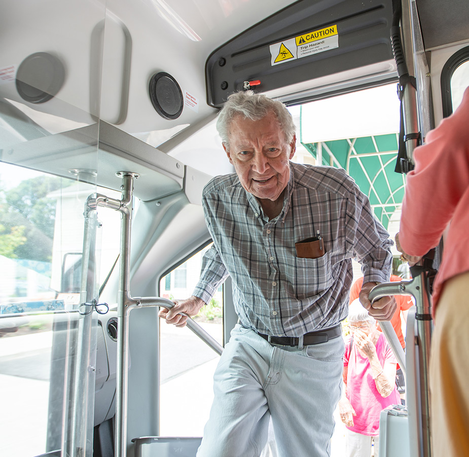 People getting on a bus.
