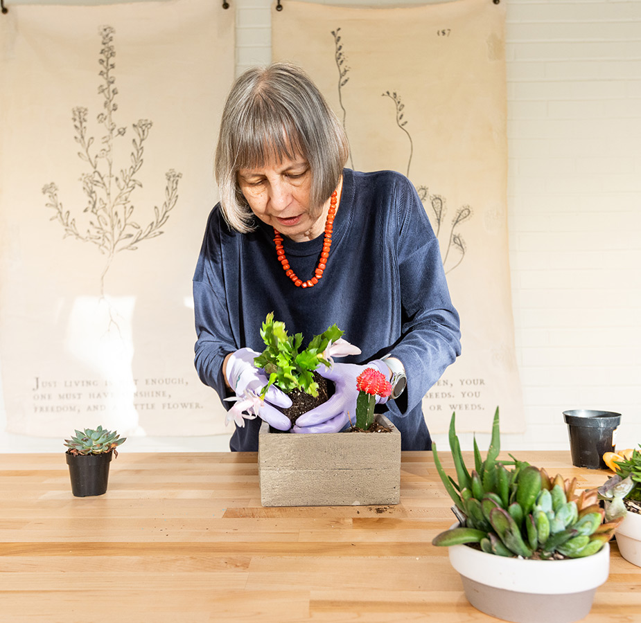 A person planting flowers.