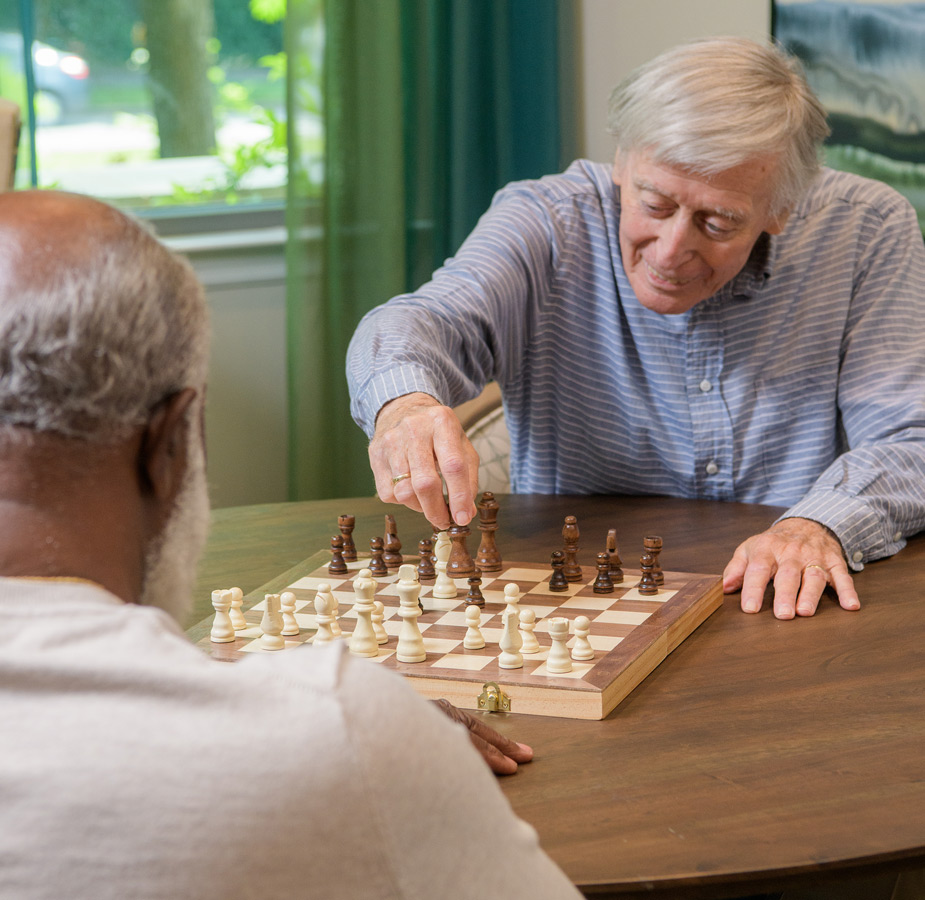 Residents play a game of chess.