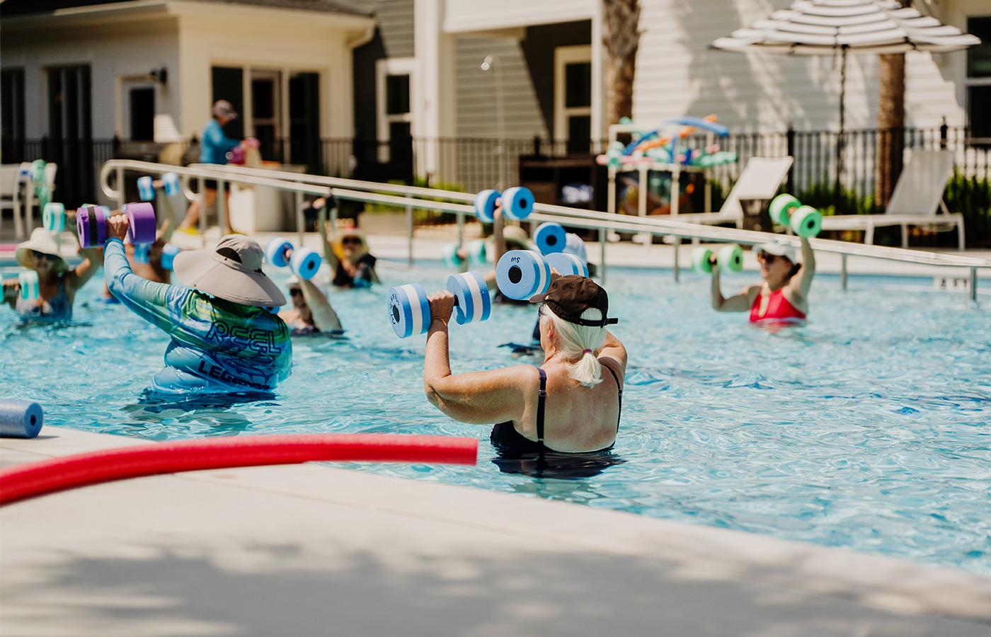 People in a water aerobics class.