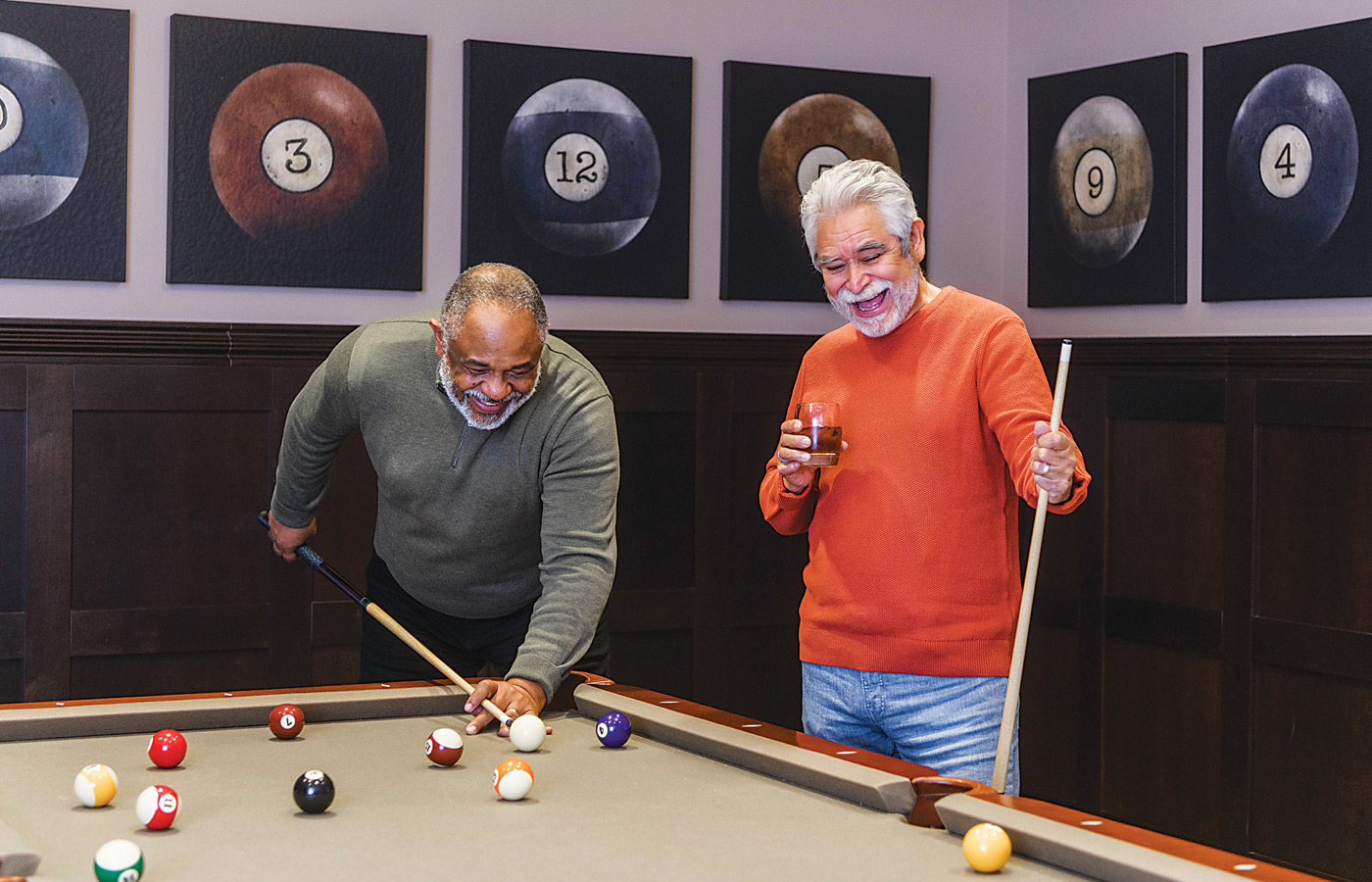Residents enjoying a game of pool.