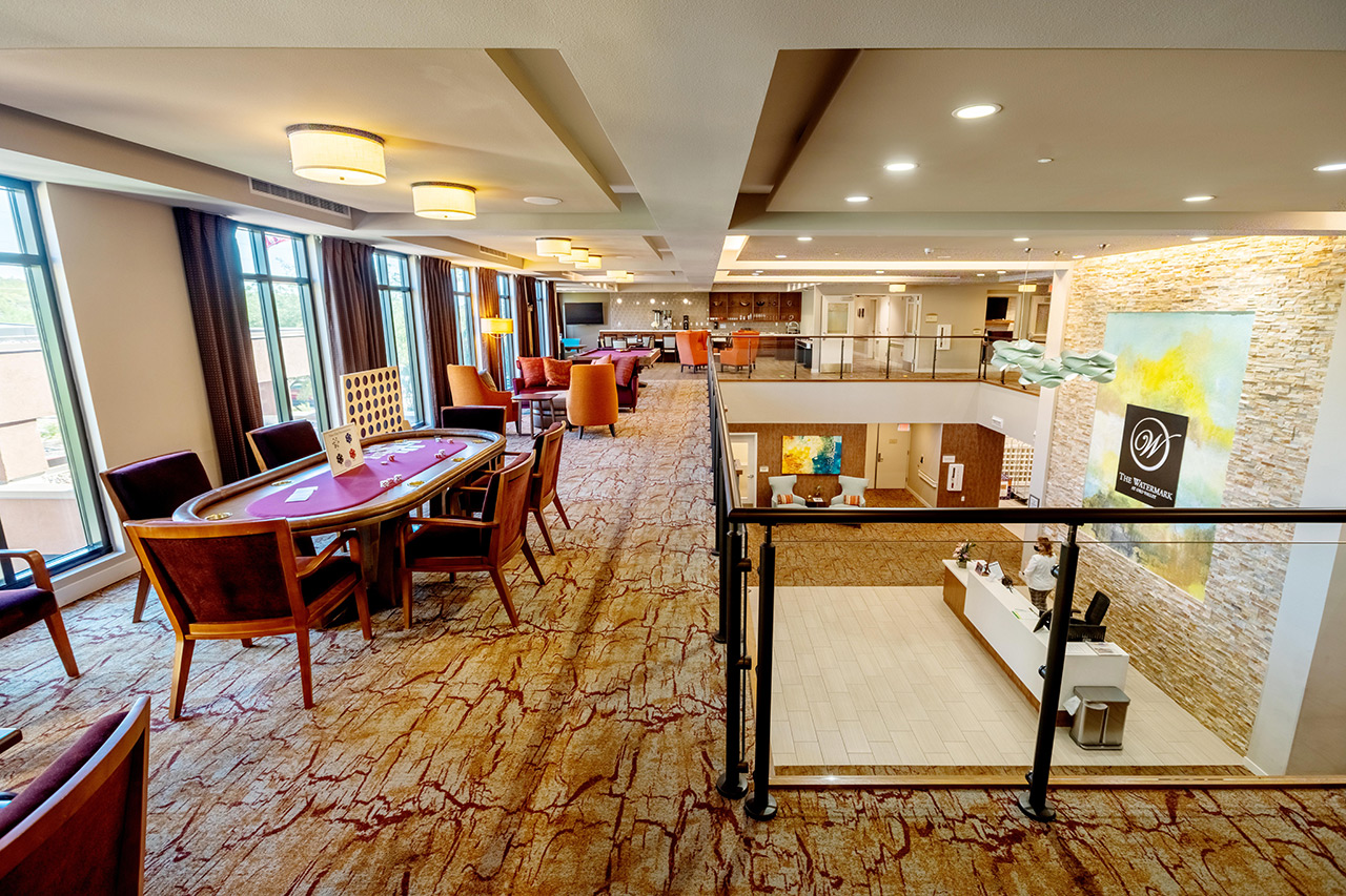 activity room with poker table on floor over lobby