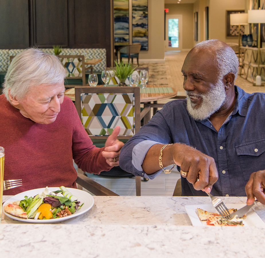 Two residents sharing a meal and friendship.