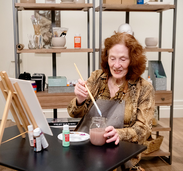 A resident in a painting class.