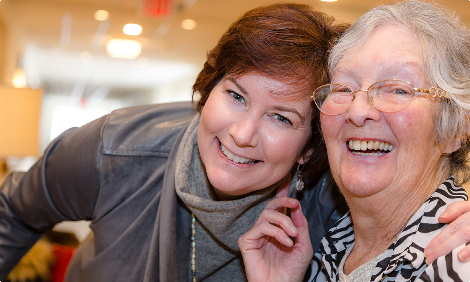 An elderly woman and her daughter laughing Residents laughing.