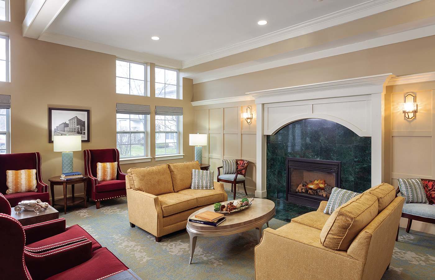 A seating area in front of a fire place at The Legacy at Park Crescent.