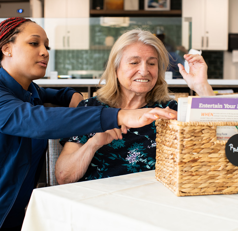 A caregiver helping a resident.