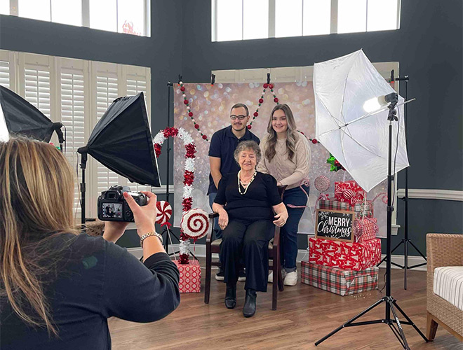 A family is having professional family photos done.