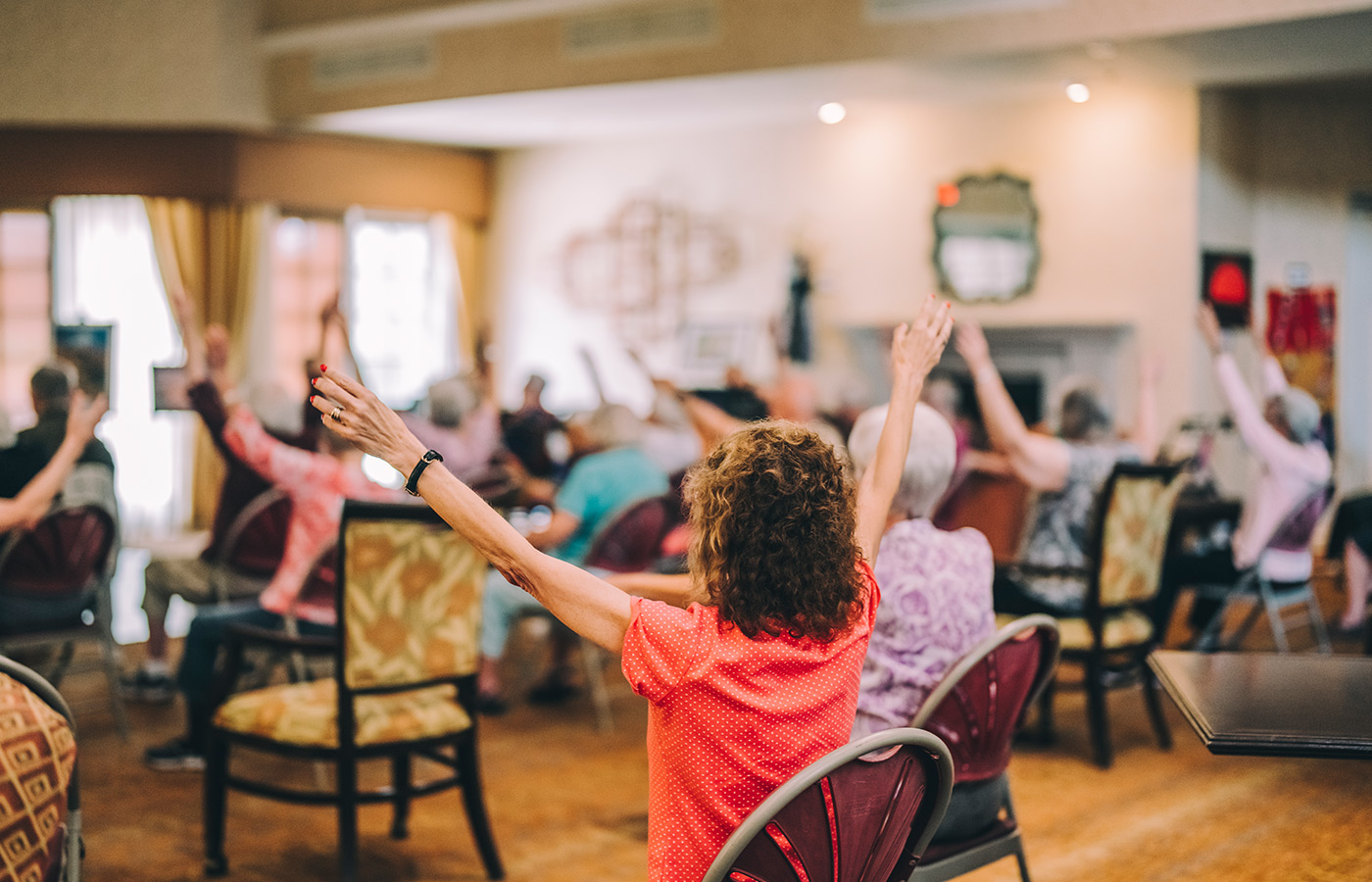 residents sitting down participating in a fitness class