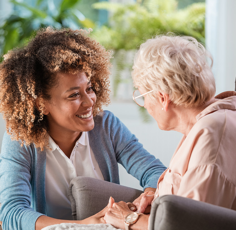 A resident is chatting with a caregiver.