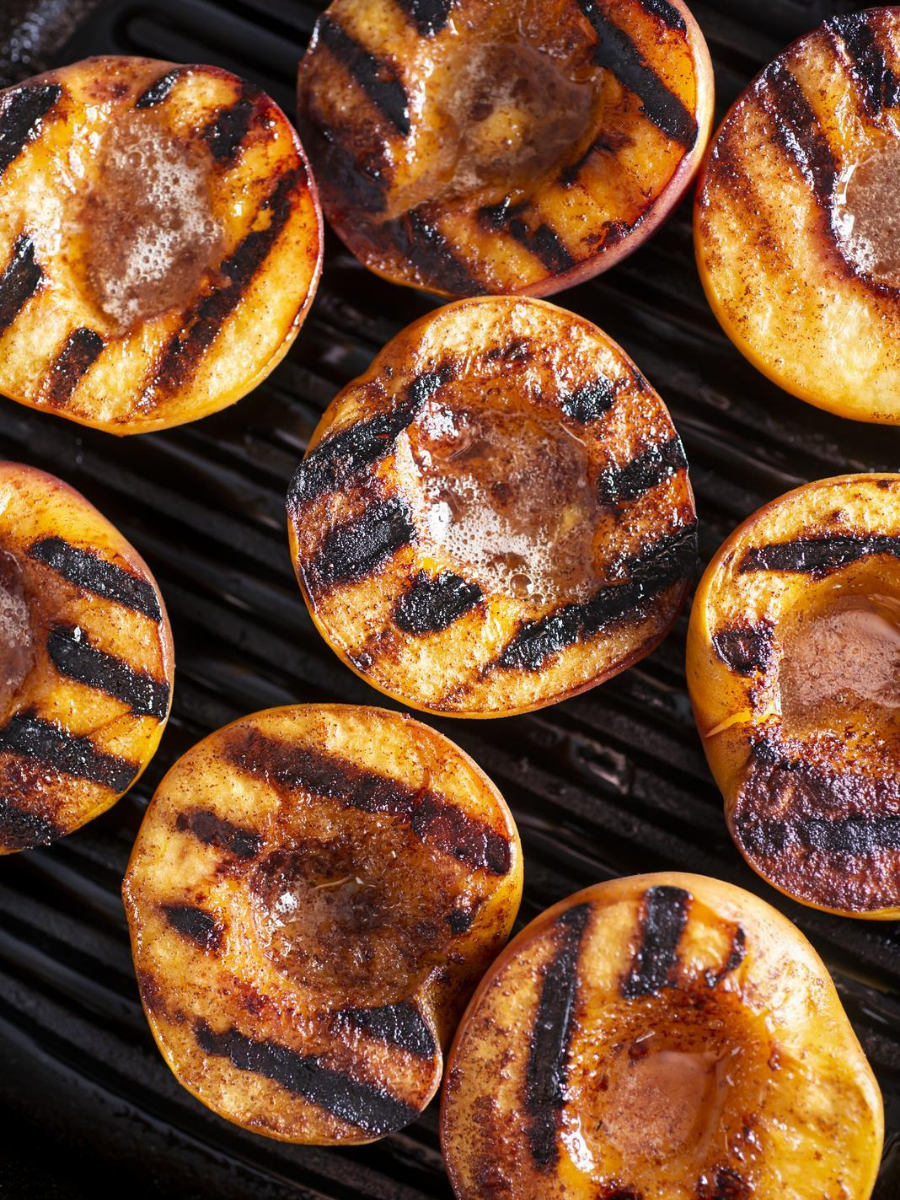 Grilled peaches on grill