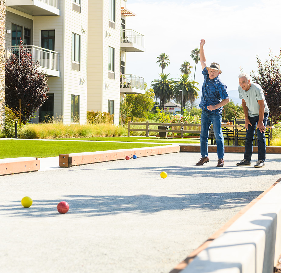 Residents are playing bocce ball.