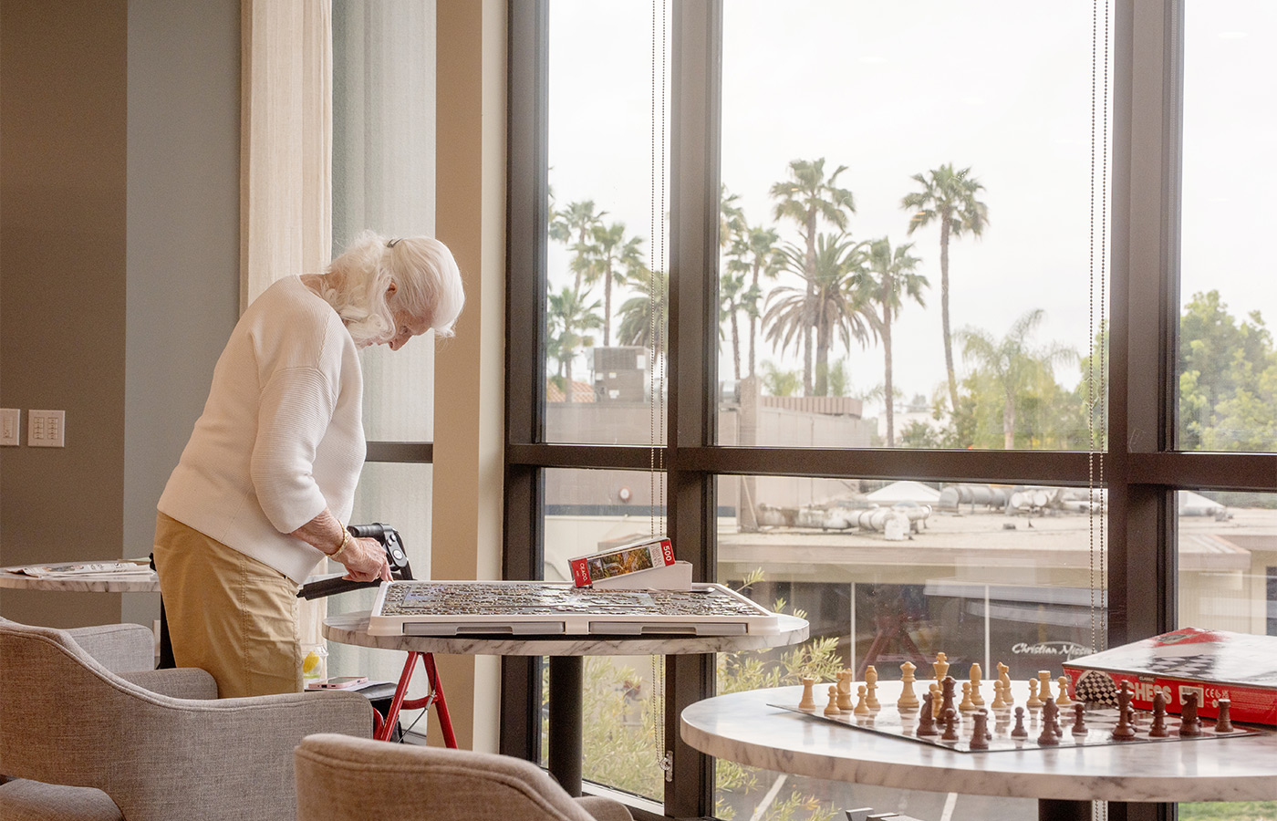A person putting a puzzle together.
