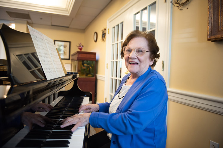 A resident plays piano.