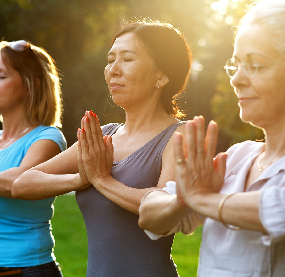People meditating during yoga.