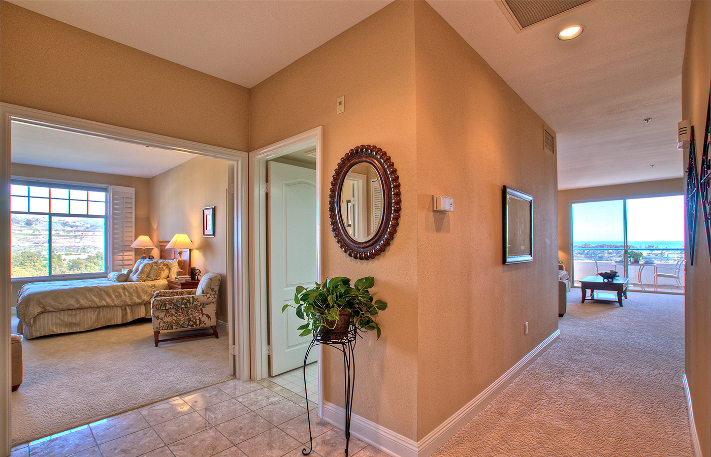 Furnished living room space with sofa, table, and seating area.