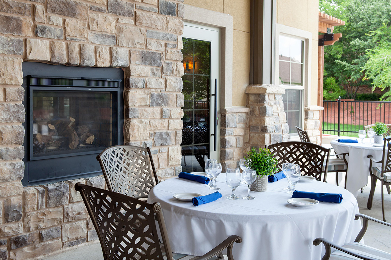 Seating dining area by a fireplace.