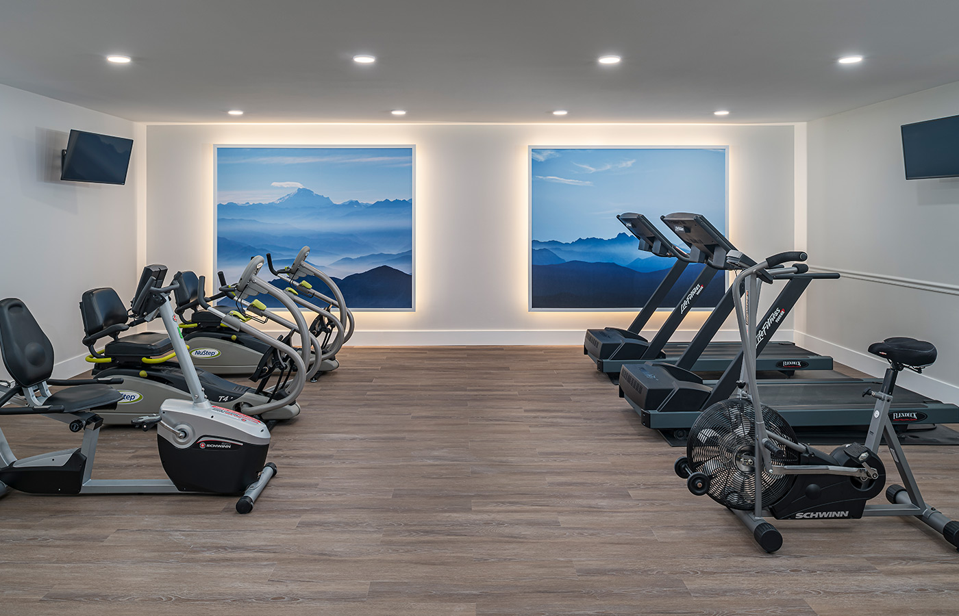 A fitness room with exercise equipment.