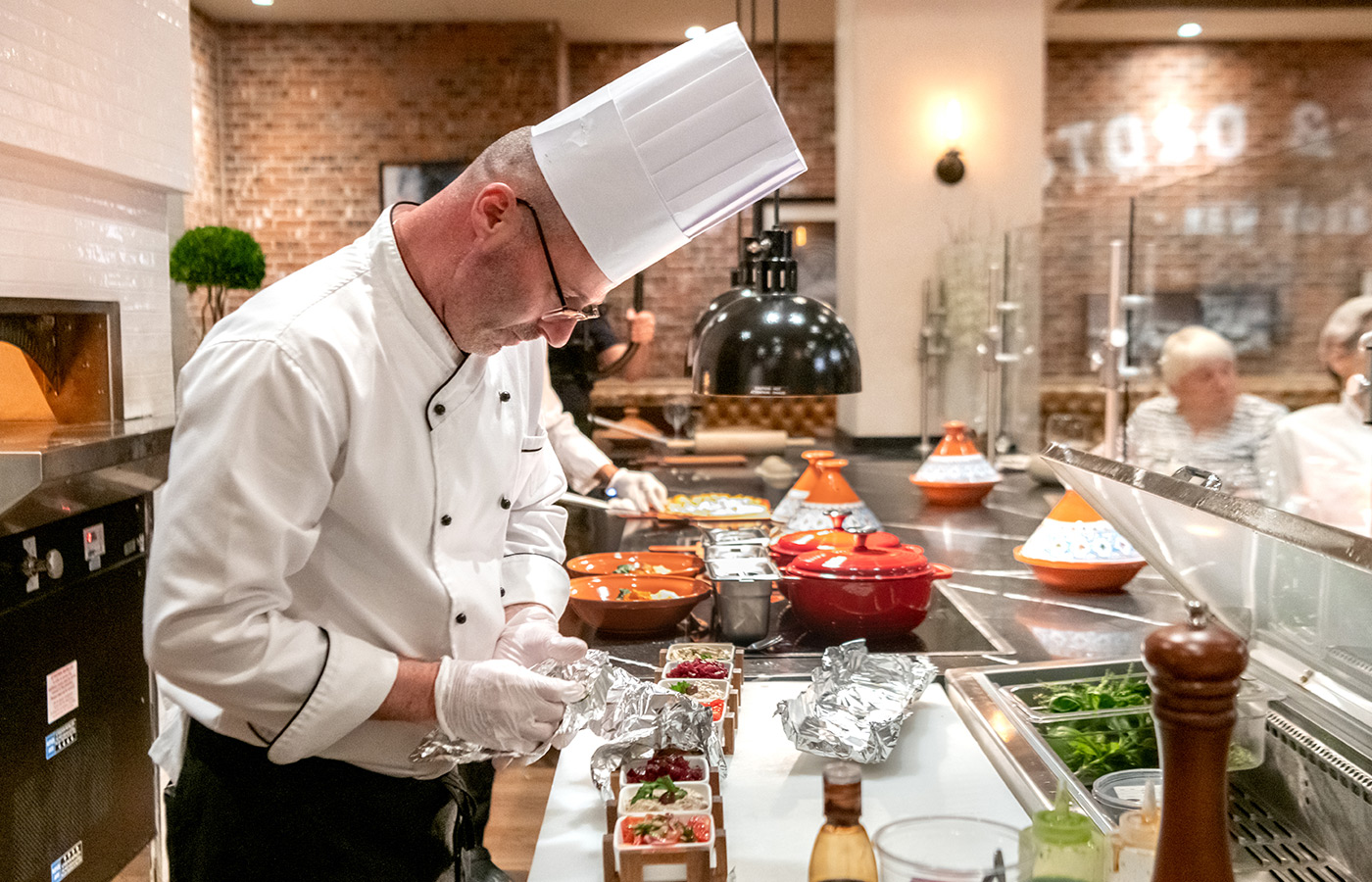 Chef prepares food.