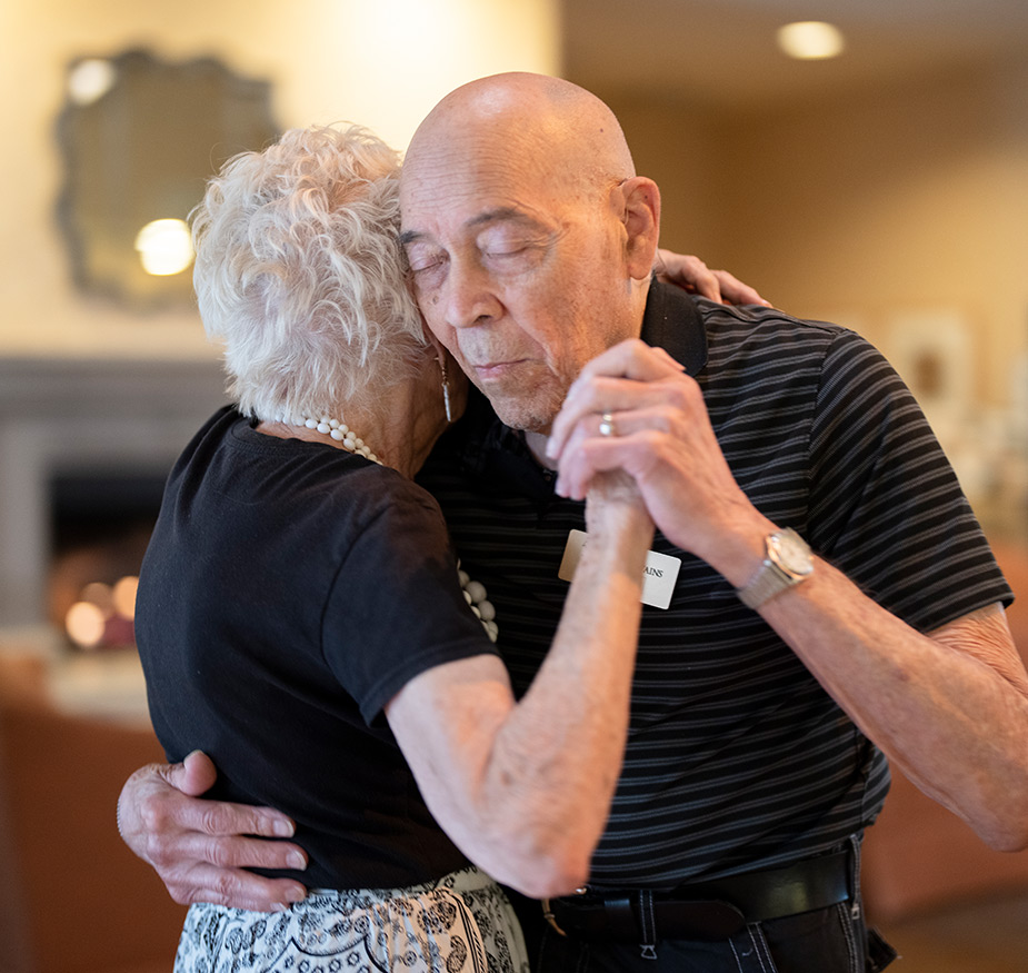 Residents are slow dancing together.