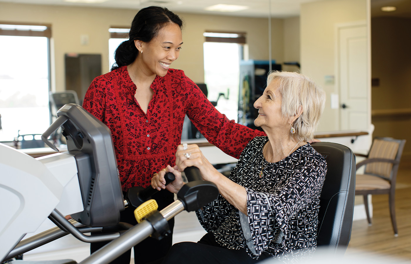A resident working with a physical therapist.