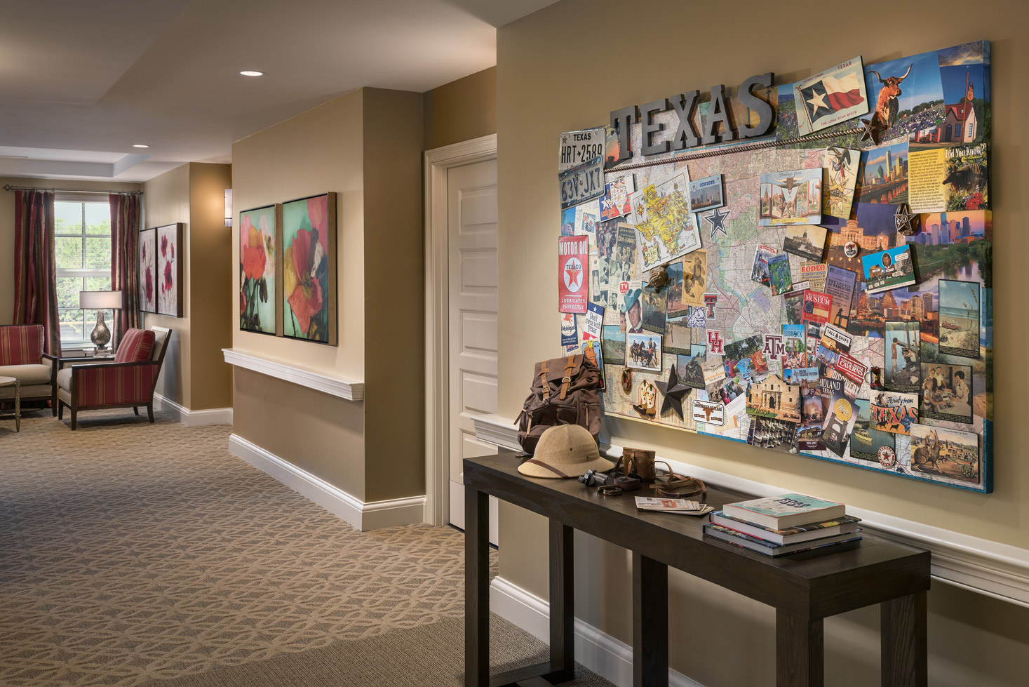 The Preston at the Park Cities hallway with table along wall and large piece of art hanging