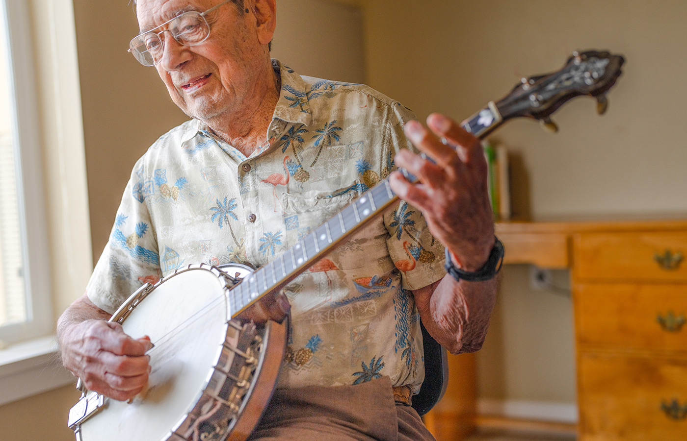 A resident is playing the banjo.