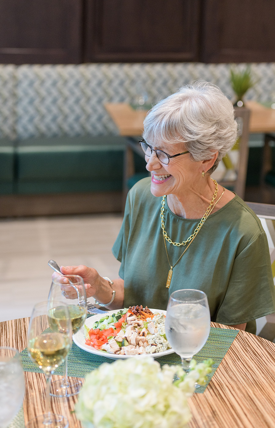 person eating a meal and laughing