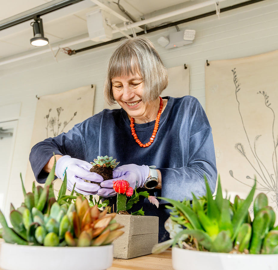 A resident working with plants.