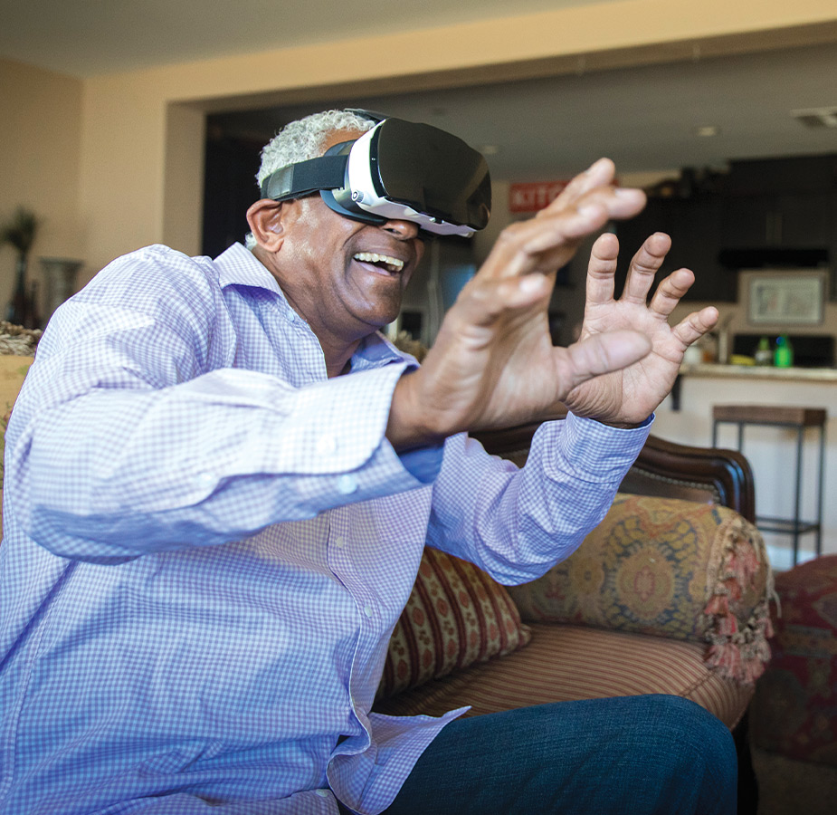 A resident enjoying virtual reality with goggles on.
