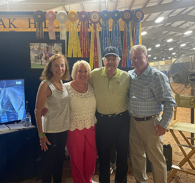 A group of people at a horse show.