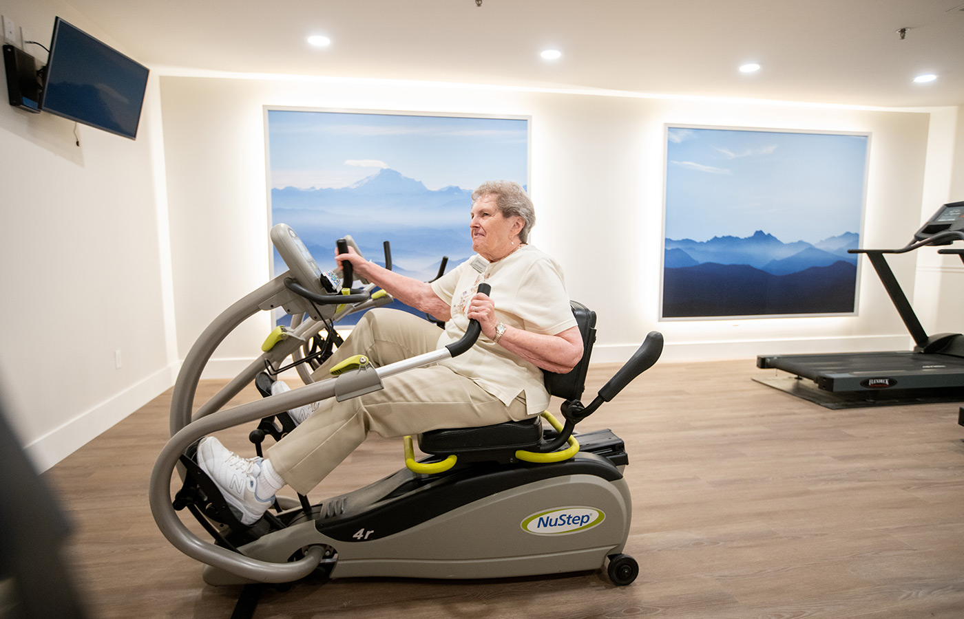 A person on an exercise bike.