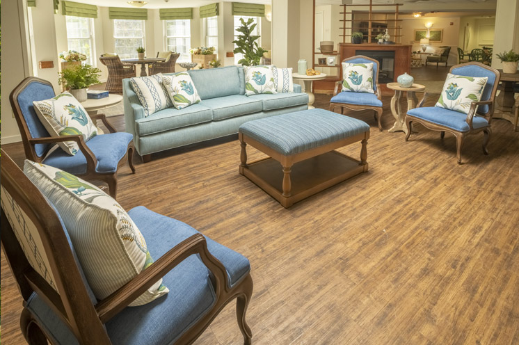 Seating area with sofas and chairs and a coffee table.