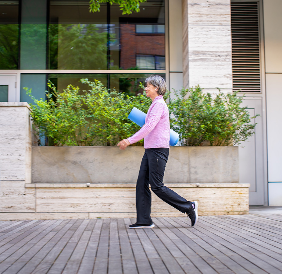 A person walking to yoga class.