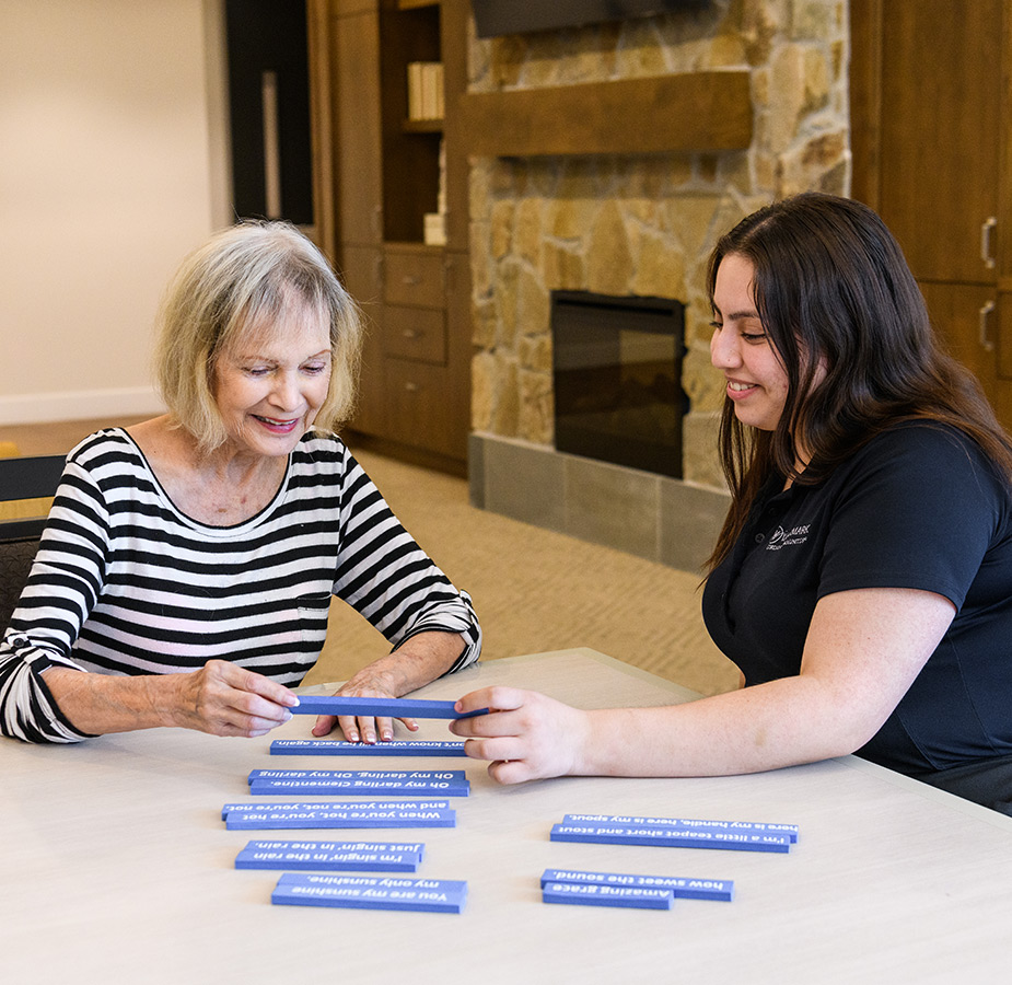 A caregiver doing an activity with a resident.