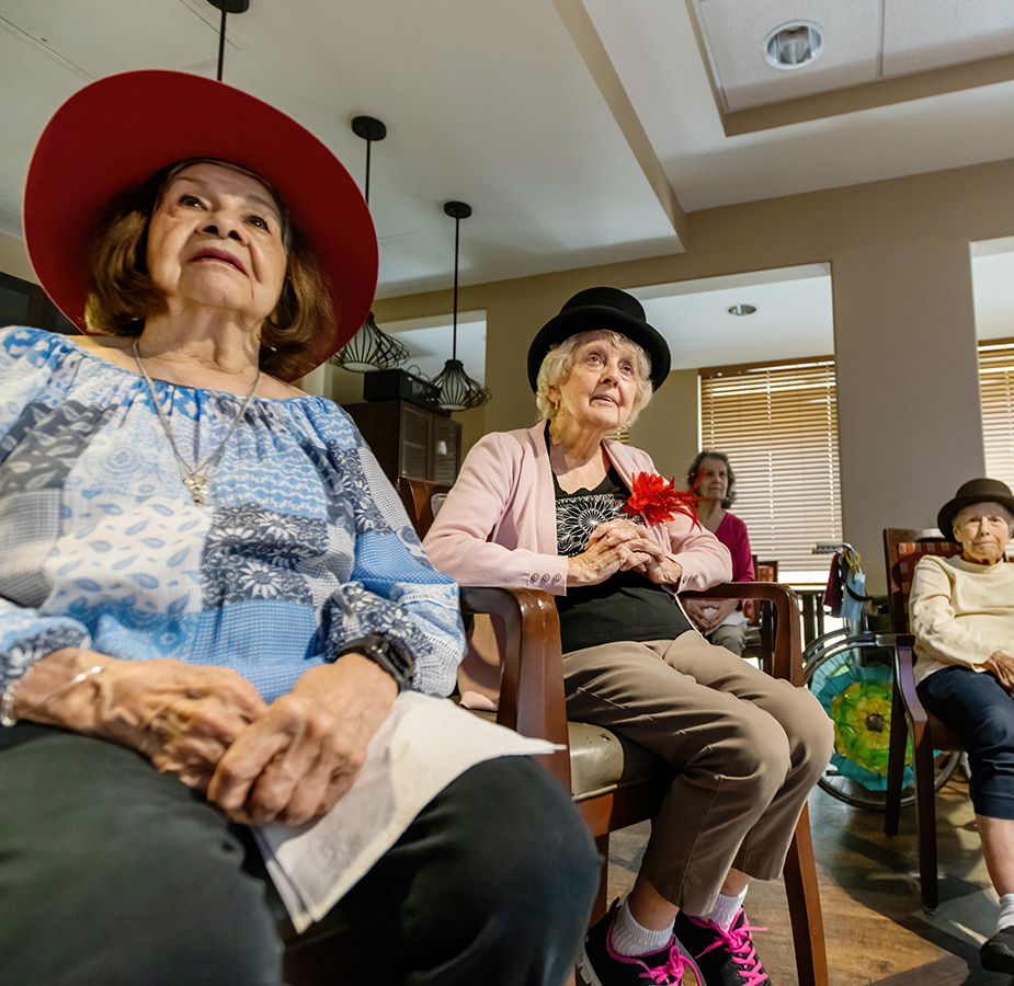 Residents wearing hats during a WU class on British hats.