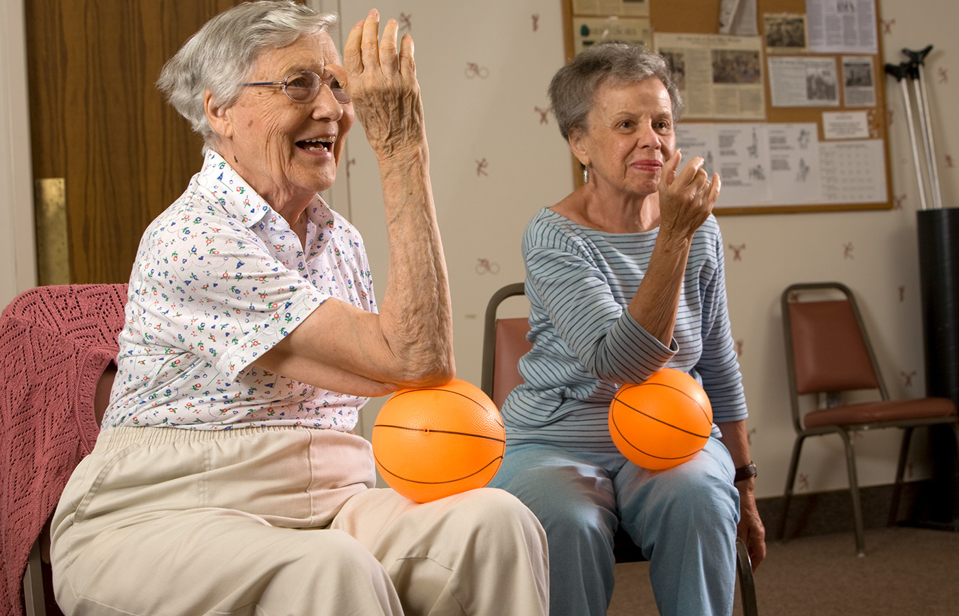 Two residents in a fitness class.