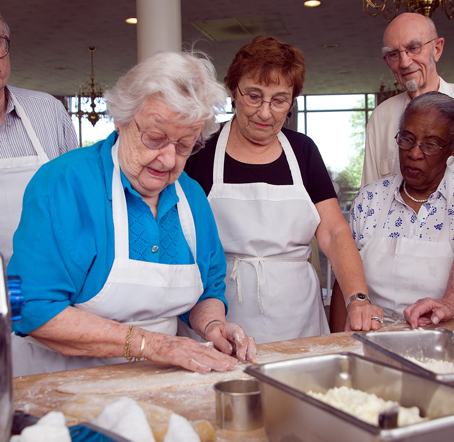 Residents having fun in a cooking class.
