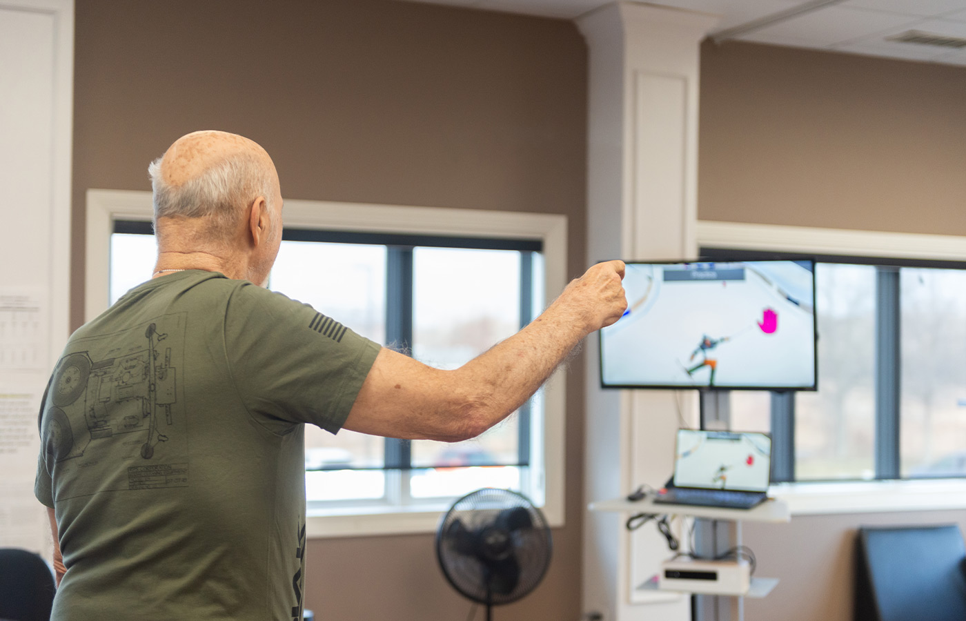 A resident working with a physical therapist.
