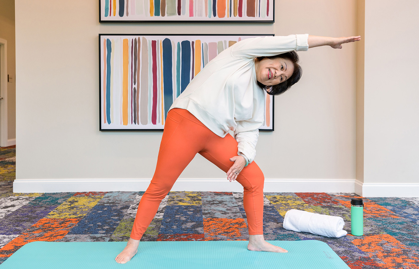 a person doing yoga in the hallway
