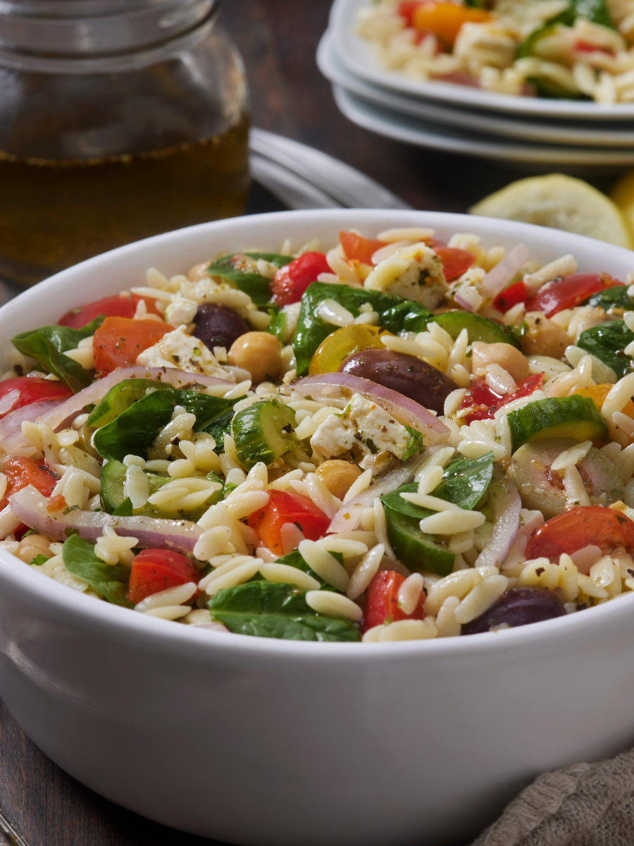 Greek-Orzo-Salad Greek Ozro Salad in a white bowl 900x1200