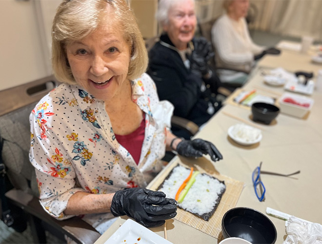 A resident is in a sushi class.