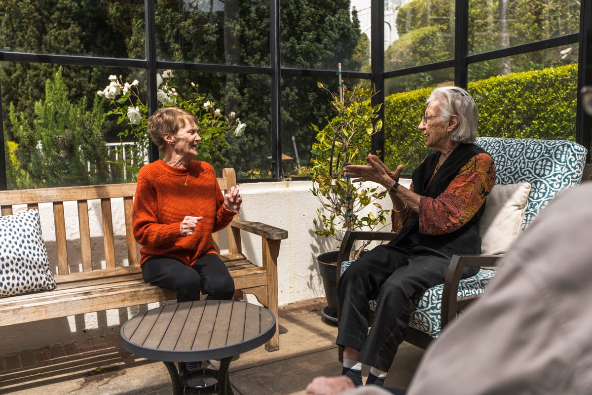 Two residents are having a conversation. 