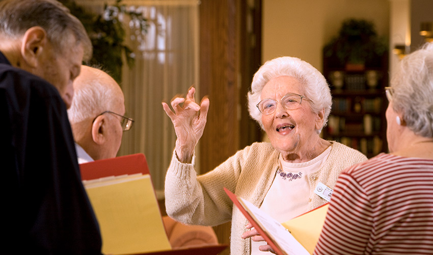 A woman singing in a class.