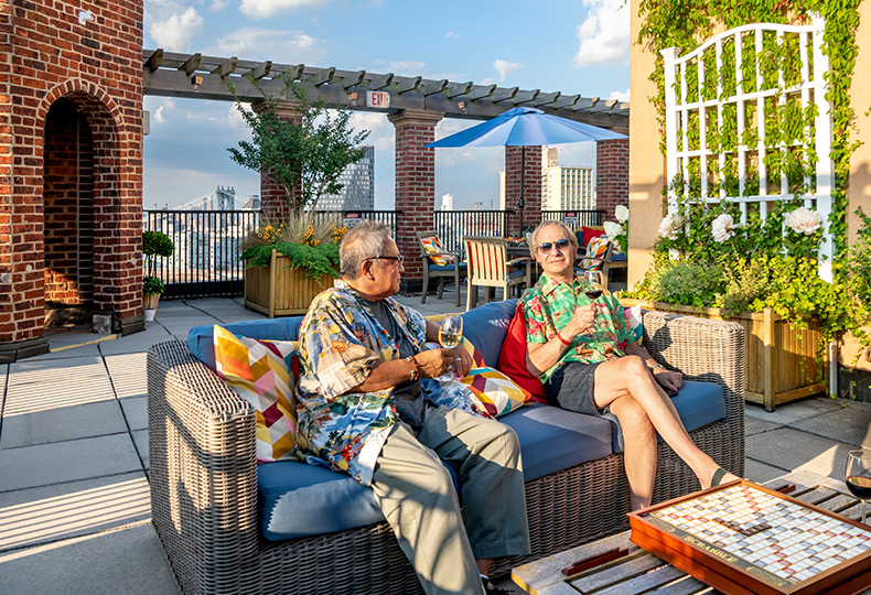 Residents having drinks on the rooftop.