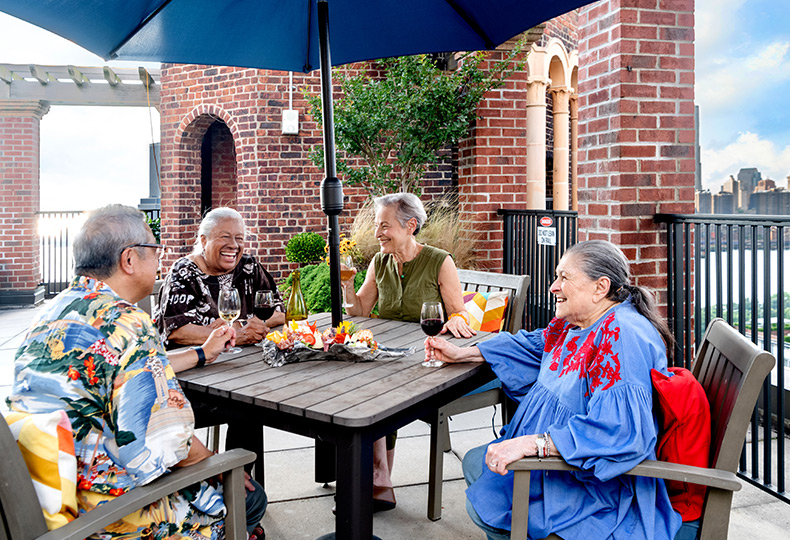 Residents having lunch on roof top.