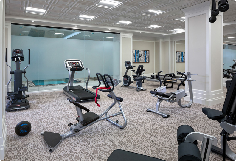 A fitness center with various types of equipment.