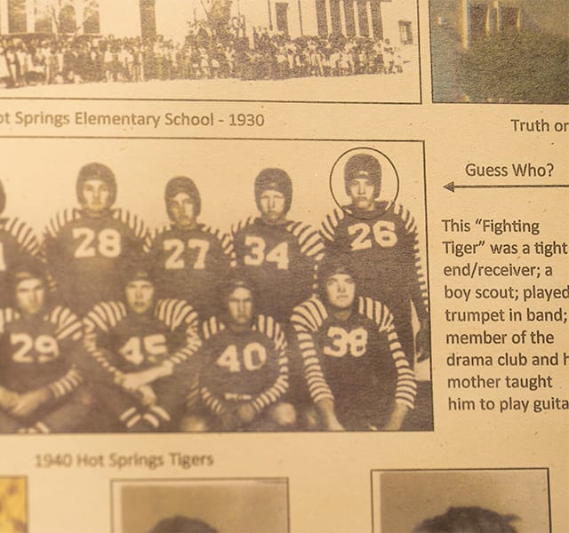 an old photograph of a football team Old newspaper featuring football players.